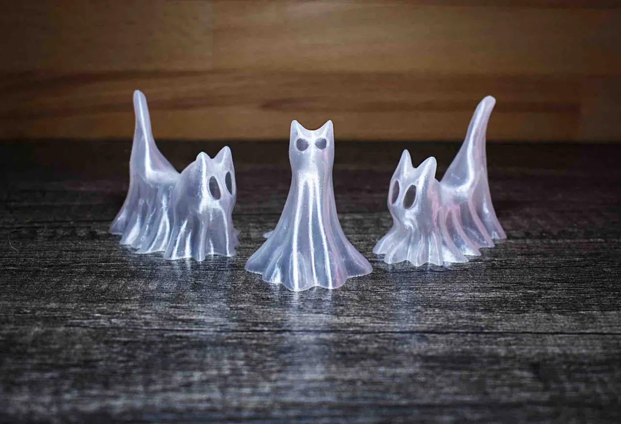 A Trio Of Halloween Ghost Cats