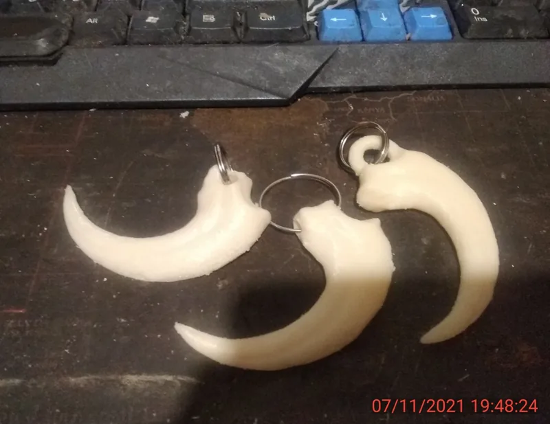 Velociraptor dinosaur claw keychain